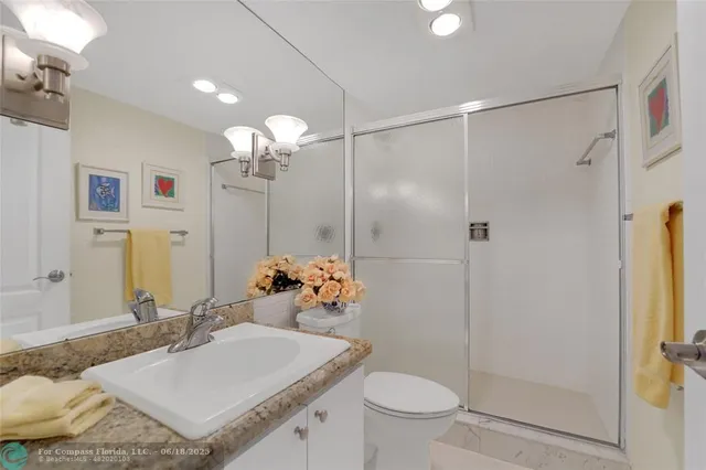 a living room with furniture a flat screen tv and a large window