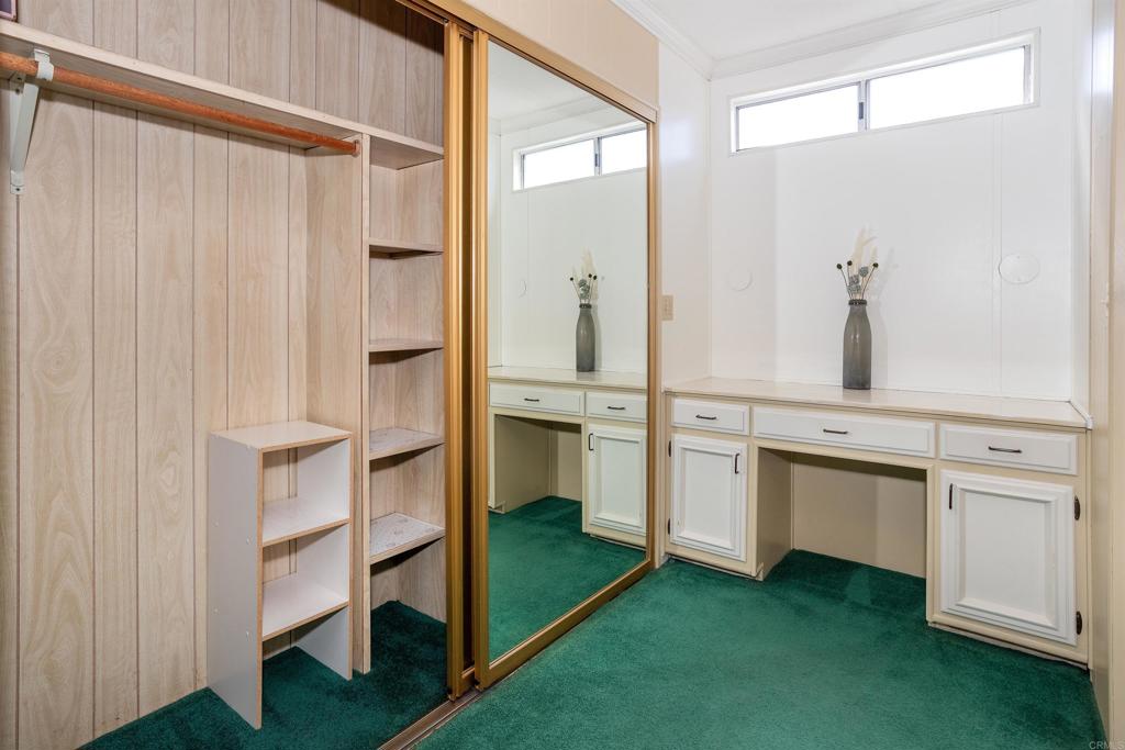 650 South Rancho Santa Fe Road, Unit 54 San Marcos, CA 92078 - Photo 9 of 21 Primary Closet and Vanity Area
