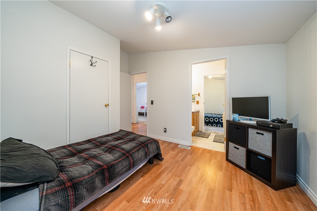 25 Caudill Road Omak, WA 98841 - Photo 11 of 40 a bedroom with furniture and flat screen tv
