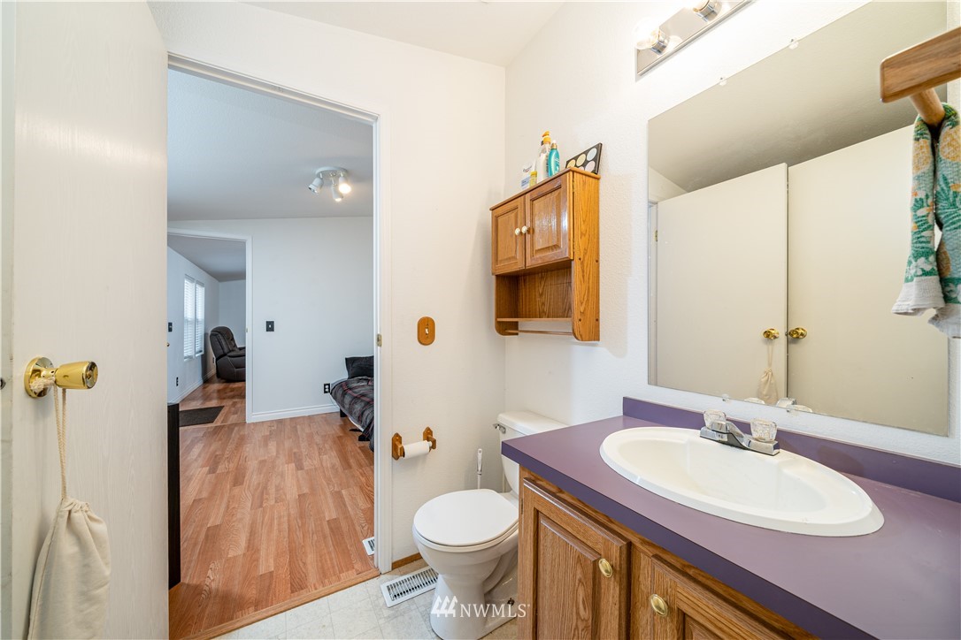 25 Caudill Road Omak, WA 98841 - Photo 18 of 40 a bathroom with a sink toilet and mirror