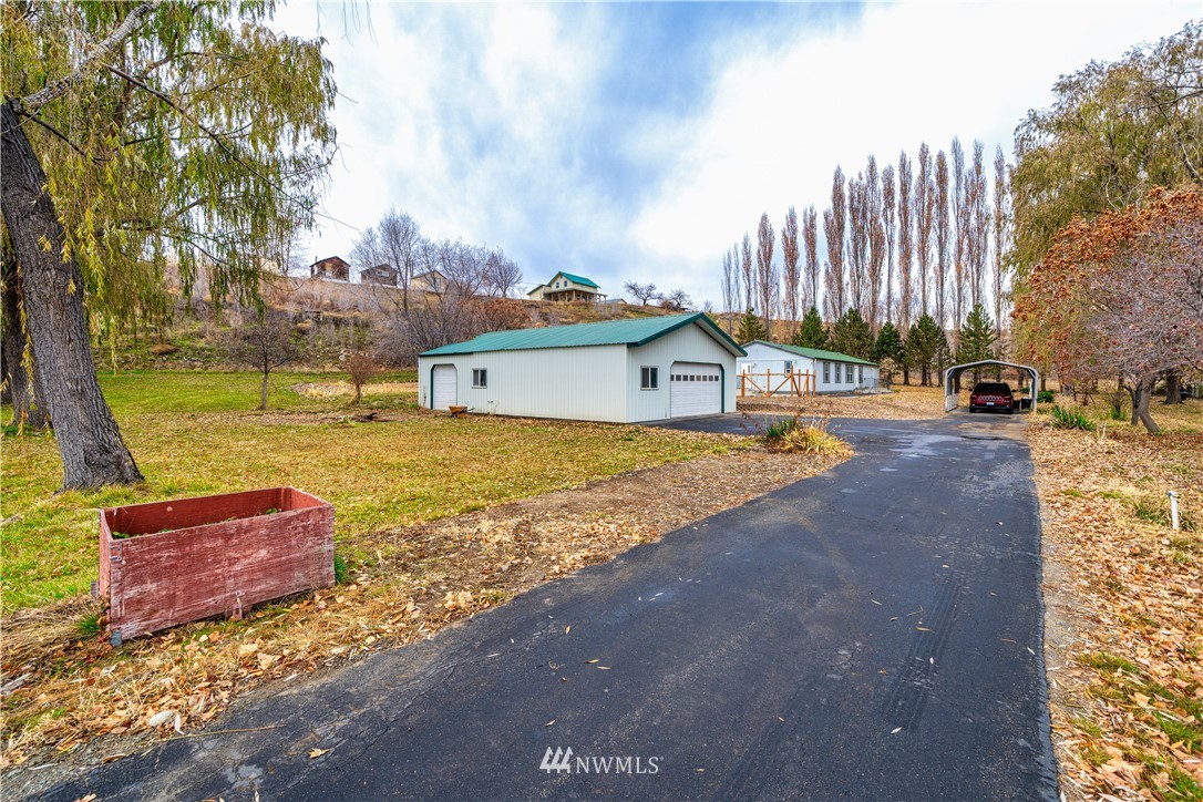 25 Caudill Road Omak, WA 98841 - Photo 37 of 40 a view of a house with swimming pool and sitting area