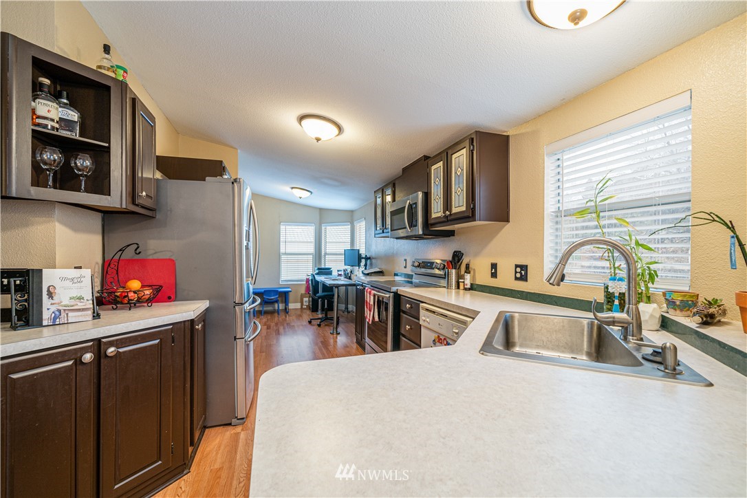 25 Caudill Road Omak, WA 98841 - Photo 8 of 40 a kitchen with a sink appliances and cabinets