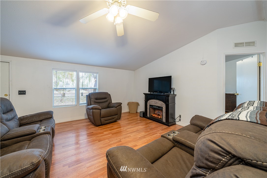 25 Caudill Road Omak, WA 98841 - Photo 10 of 40 a living room with furniture and a flat screen tv