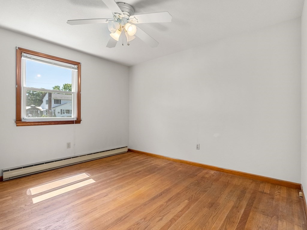 16 May Road Ludlow, MA 01056 - Photo 12 of 28 a view of empty room with wooden floor and fan