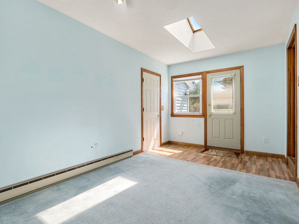 16 May Road Ludlow, MA 01056 - Photo 3 of 28 an empty room with windows