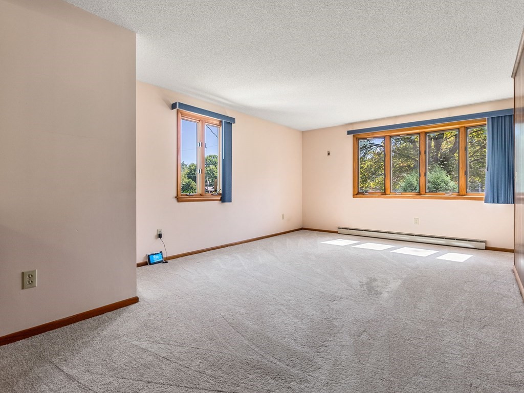 16 May Road Ludlow, MA 01056 - Photo 9 of 28 an empty room with windows