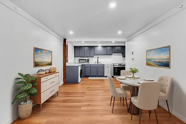 a view of kitchen with wooden floor