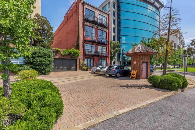 a view of a car park in front of a building