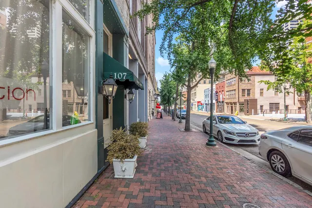 a view of a patio with table and chairs and potted plants