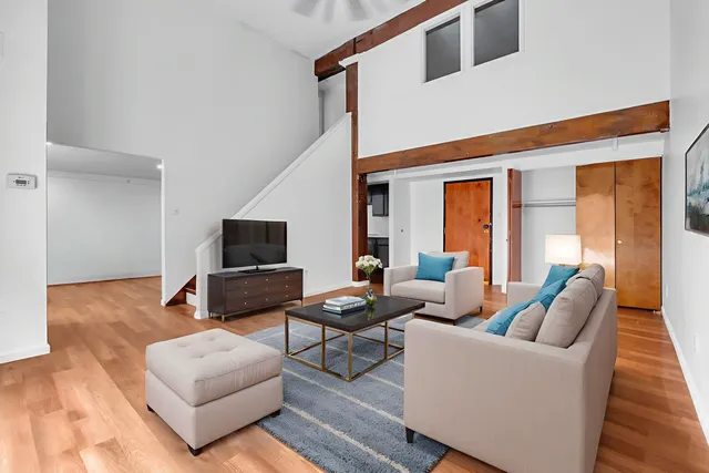 a view of an entryway with wooden floor