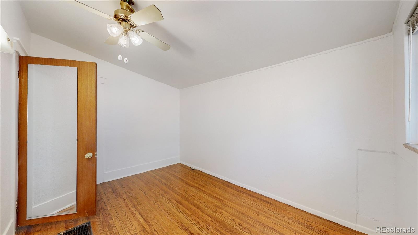 4169 Hooker Street Denver, CO 80211 - Photo 17 of 48 a view of empty room with wooden floor