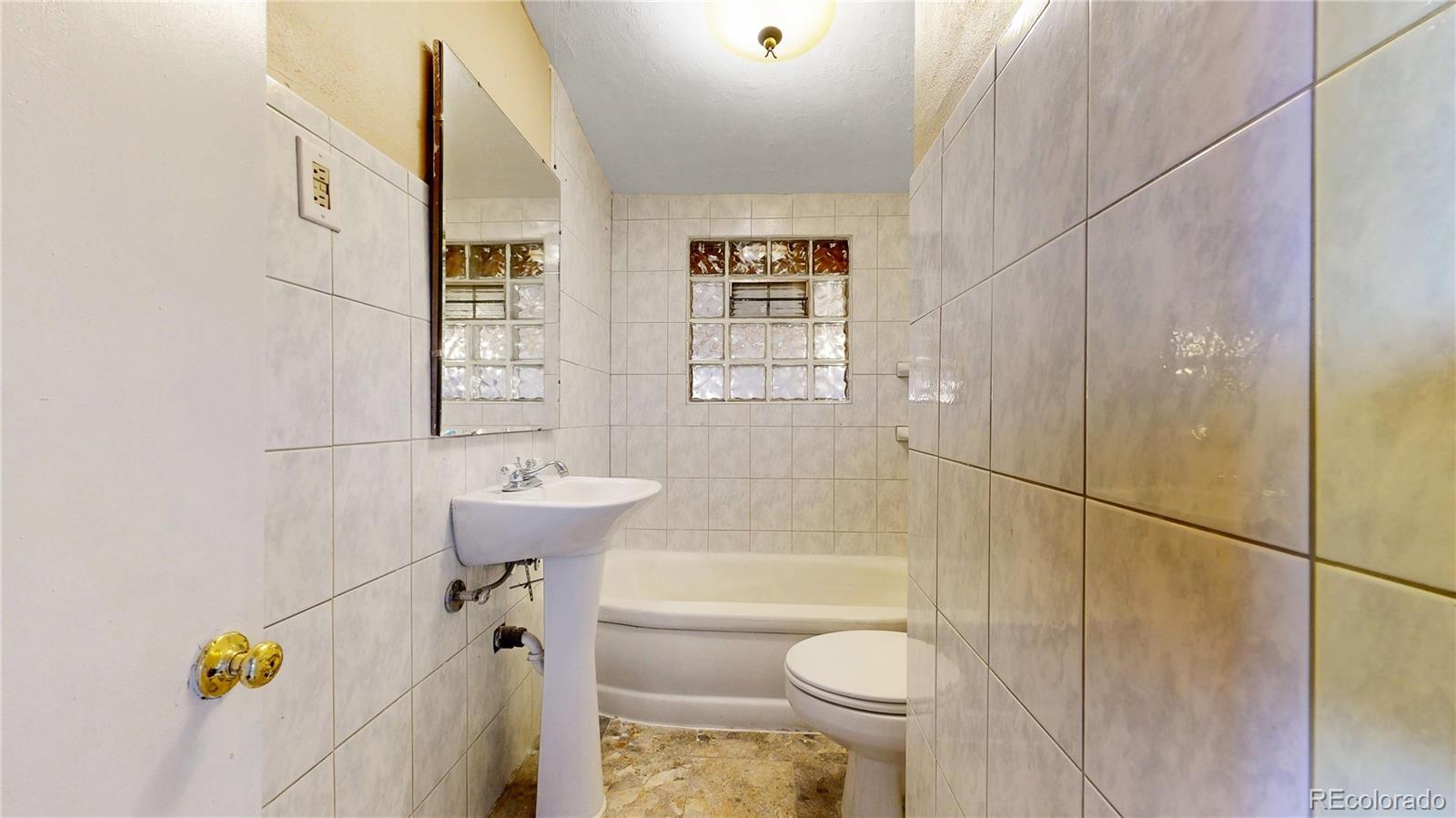 4169 Hooker Street Denver, CO 80211 - Photo 19 of 48 a bathroom with a sink toilet and shower