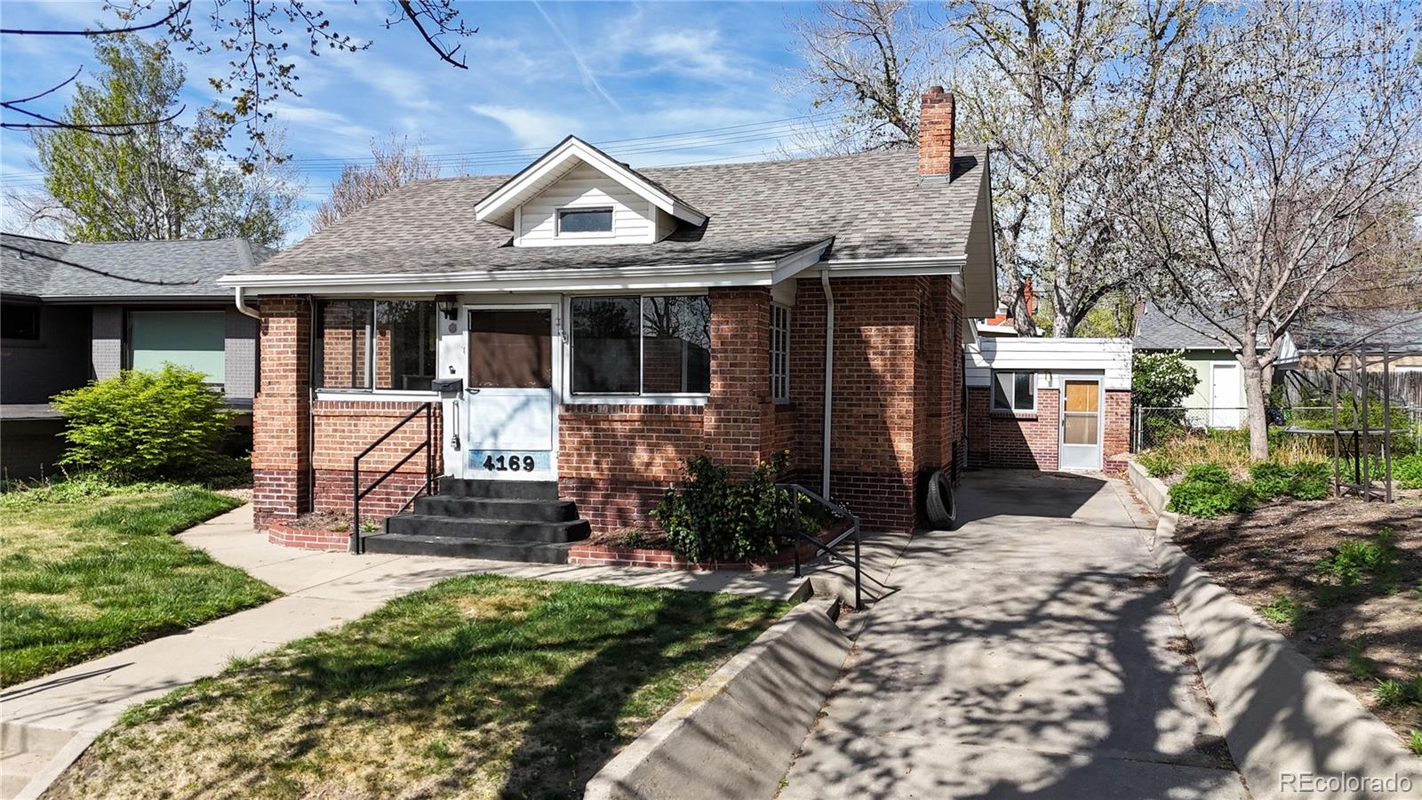 4169 Hooker Street Denver, CO 80211 - Photo 2 of 48 a front view of a house with a porch