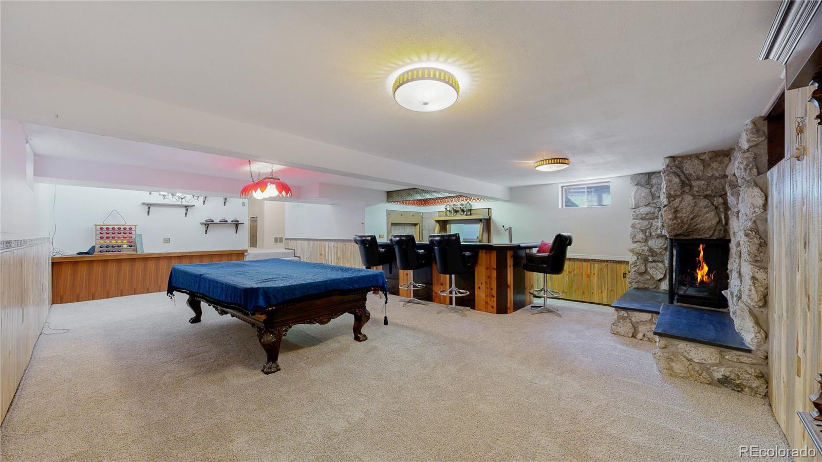 4169 Hooker Street Denver, CO 80211 - Photo 26 of 48 a living room with furniture pool and a table