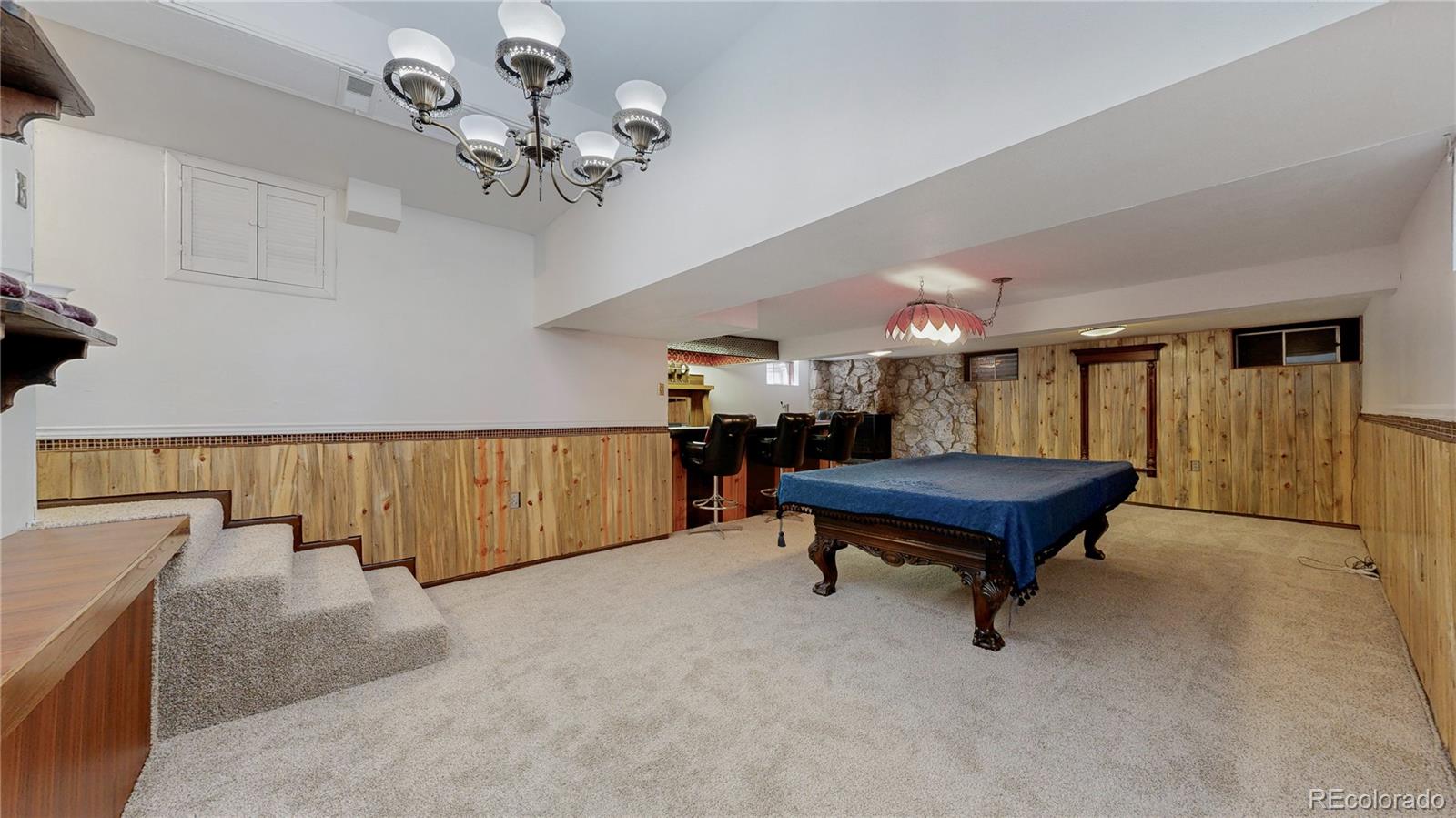 4169 Hooker Street Denver, CO 80211 - Photo 27 of 48 a room with pool table and a chandelier