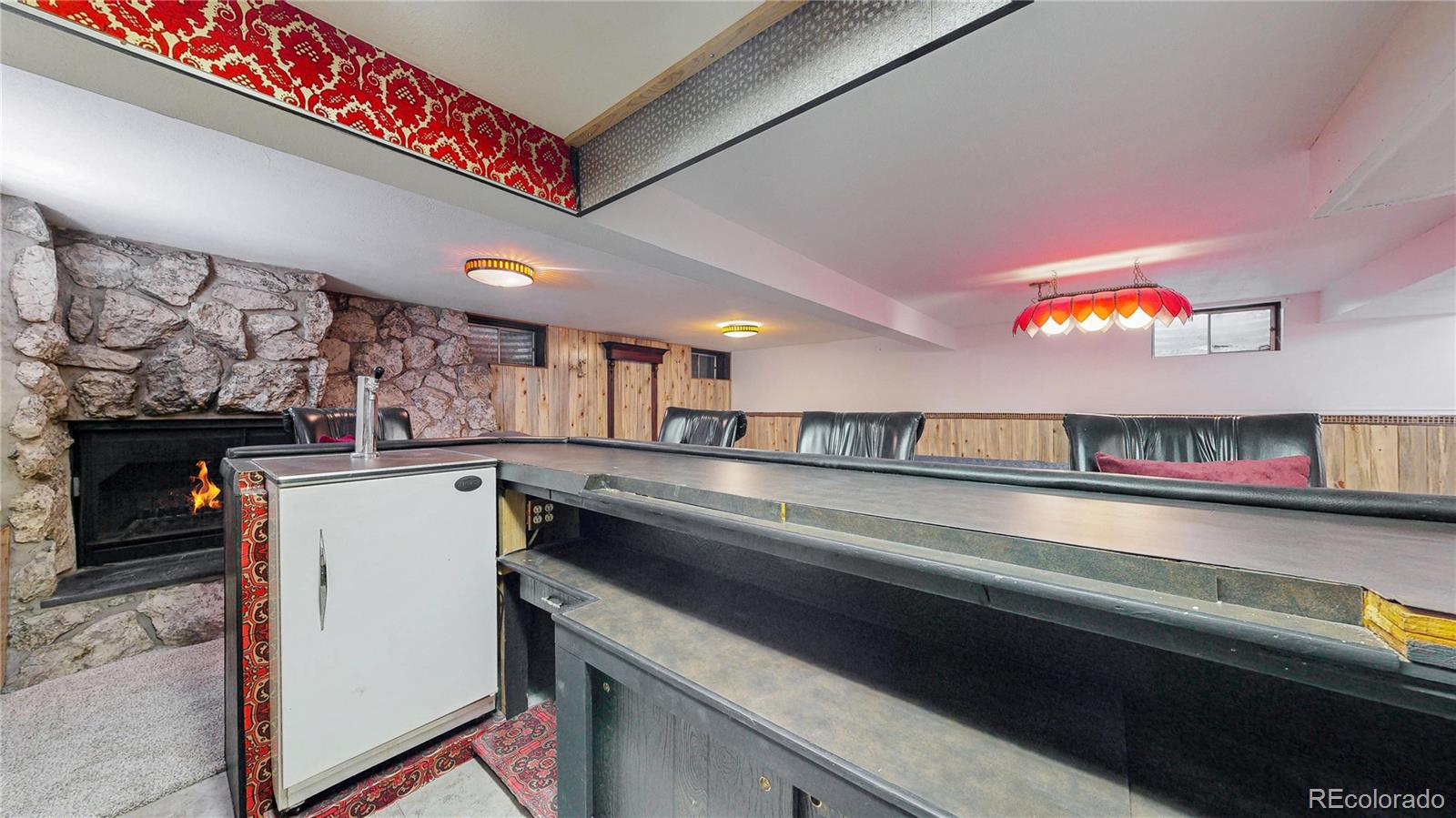 4169 Hooker Street Denver, CO 80211 - Photo 29 of 48 a kitchen with a refrigerator and a microwave