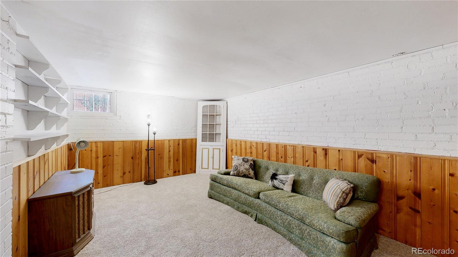 4169 Hooker Street Denver, CO 80211 - Photo 30 of 48 a living room with furniture and a wooden floor