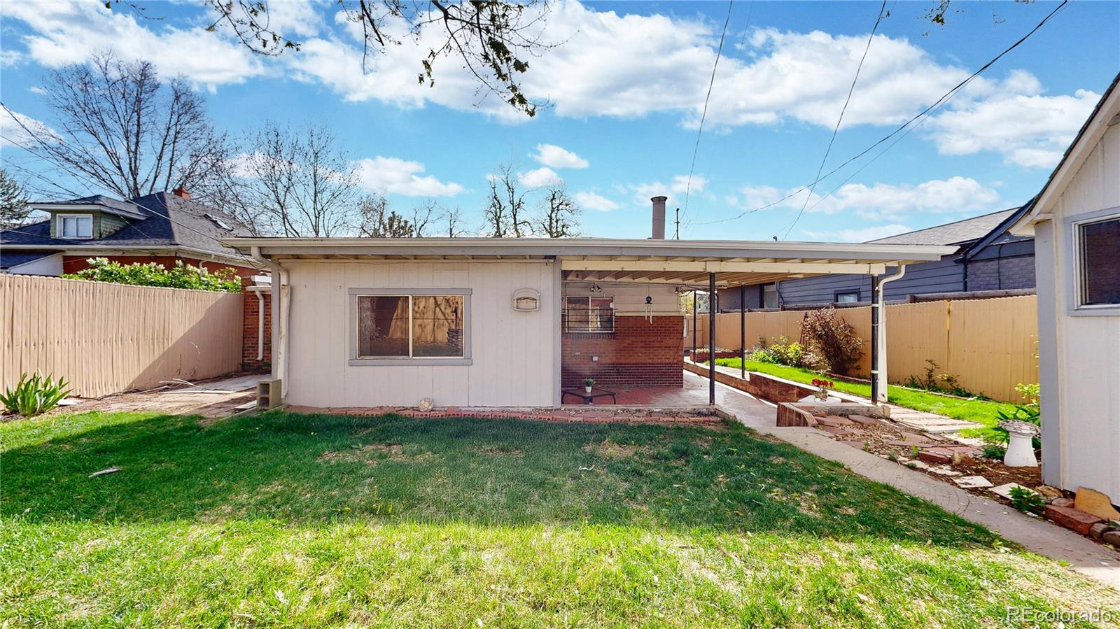 4169 Hooker Street Denver, CO 80211 - Photo 39 of 48 a view of a backyard with plants and a patio