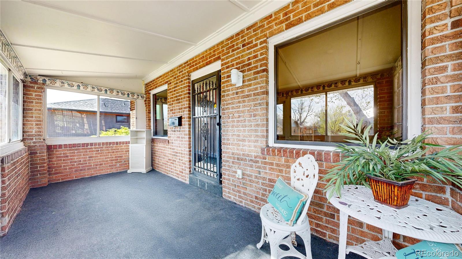 4169 Hooker Street Denver, CO 80211 - Photo 4 of 48 a view of an outdoor space with porch and wooden floor