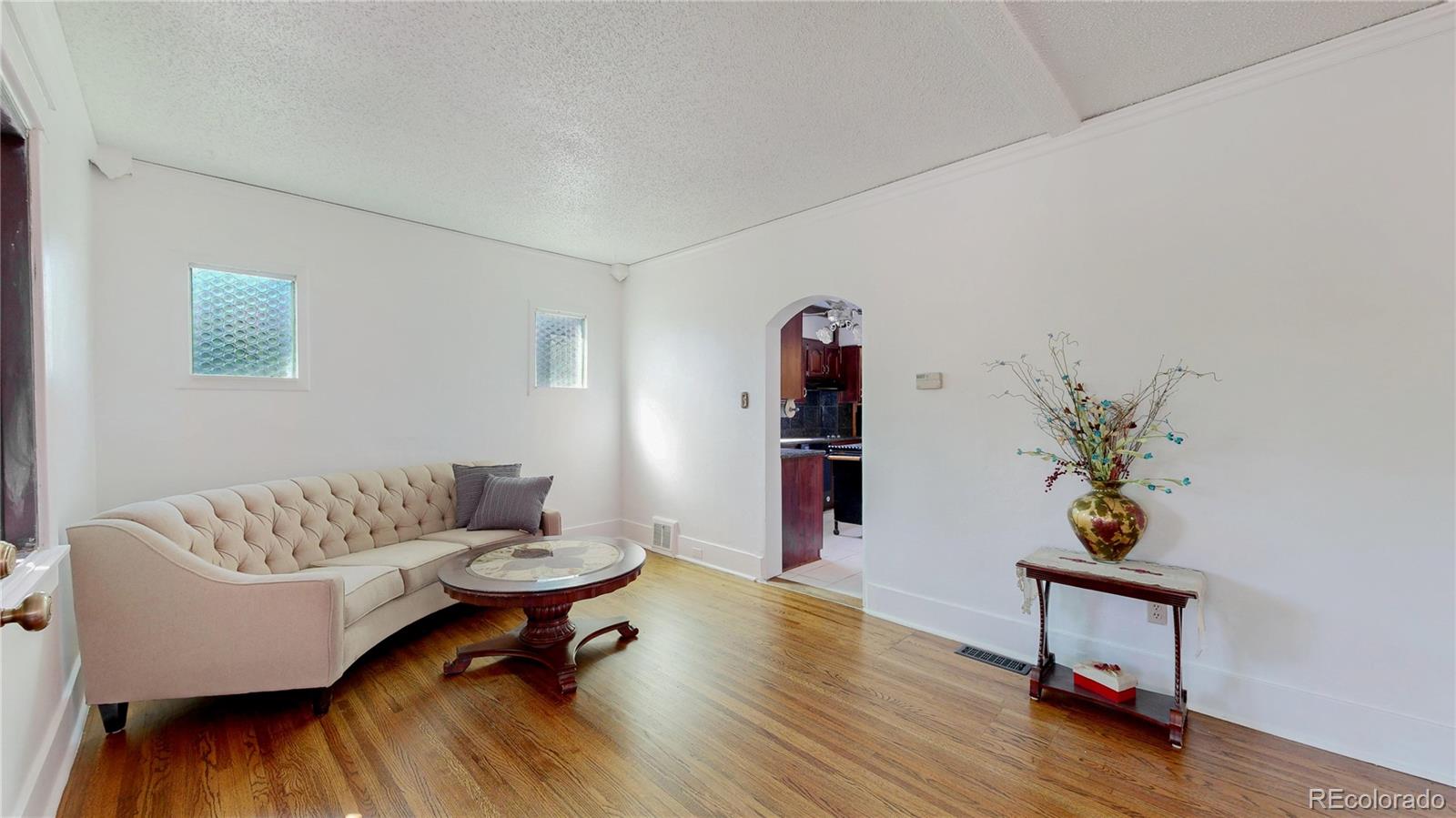 4169 Hooker Street Denver, CO 80211 - Photo 6 of 48 a living room with furniture and a potted plant
