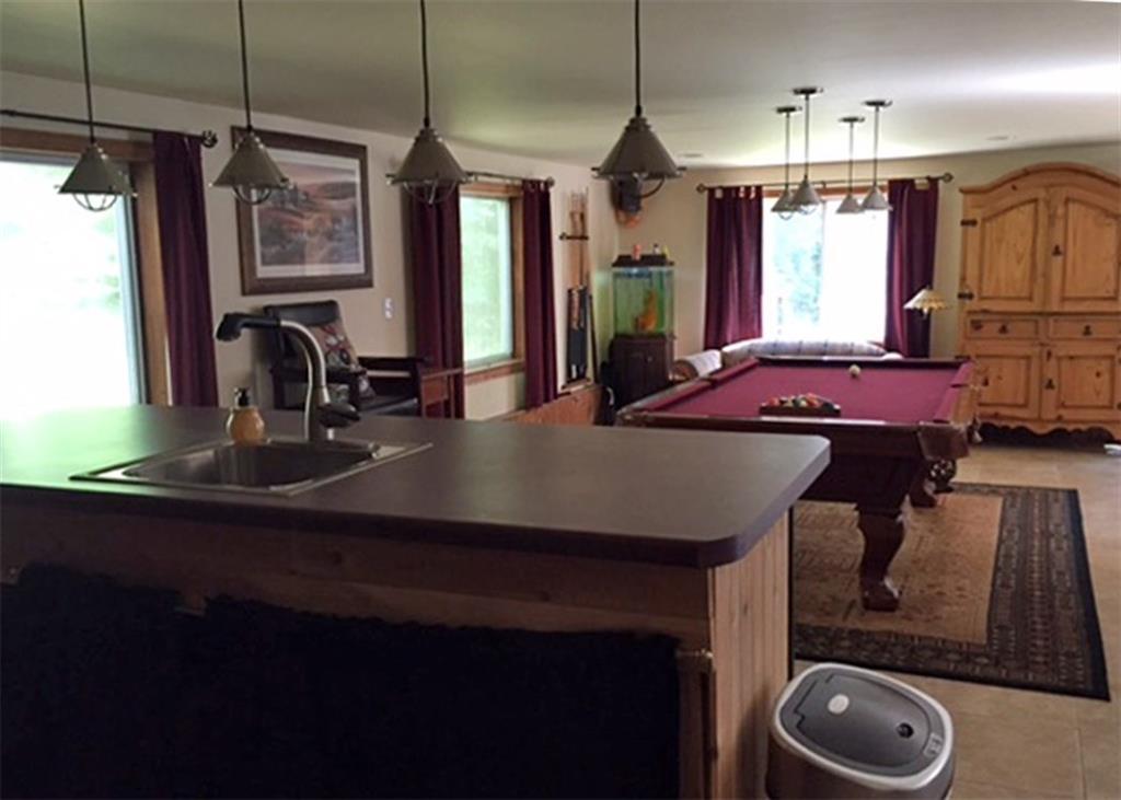 375 Hancock Pond Road Sebago, ME 04029 - Photo 26 of 34 A wet bar and pool Table (included).