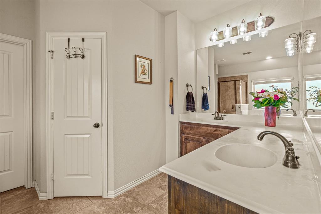 108 Bosque Court Azle, TX 76020 - Photo 14 of 33 a bathroom with a sink vanity and a mirror