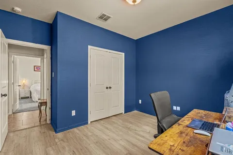 a view of room with wooden floor
