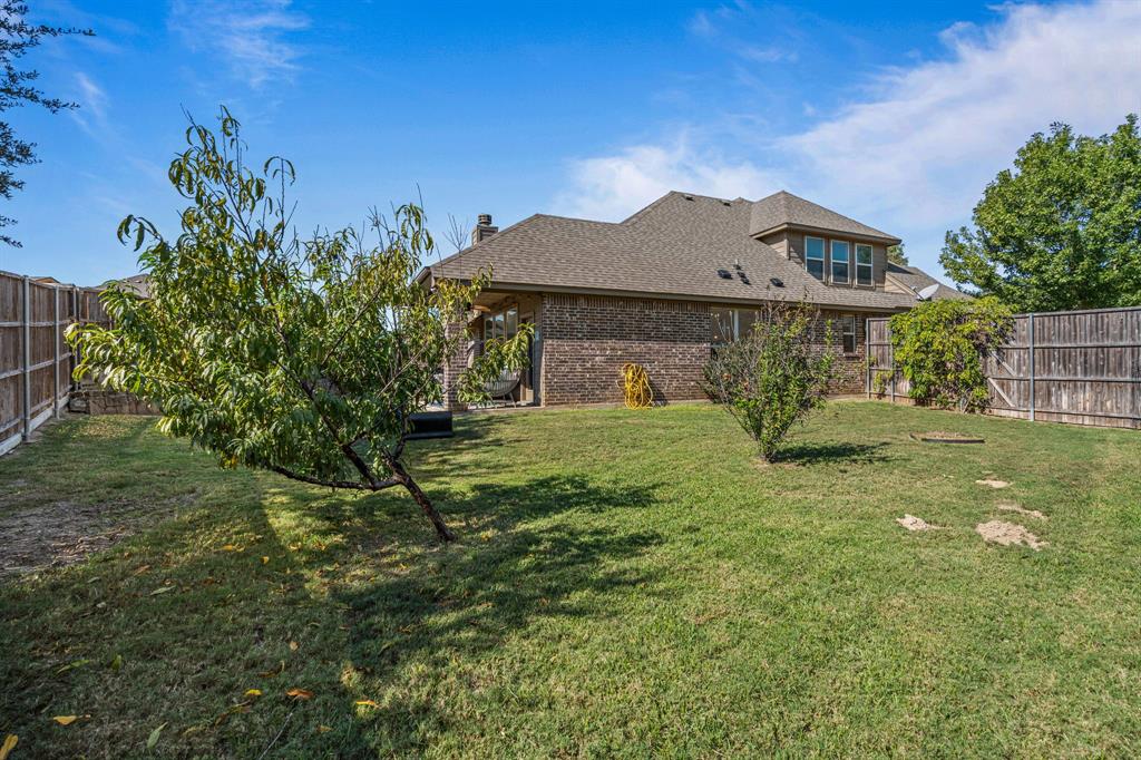 108 Bosque Court Azle, TX 76020 - Photo 22 of 33 a front view of a house with a yard