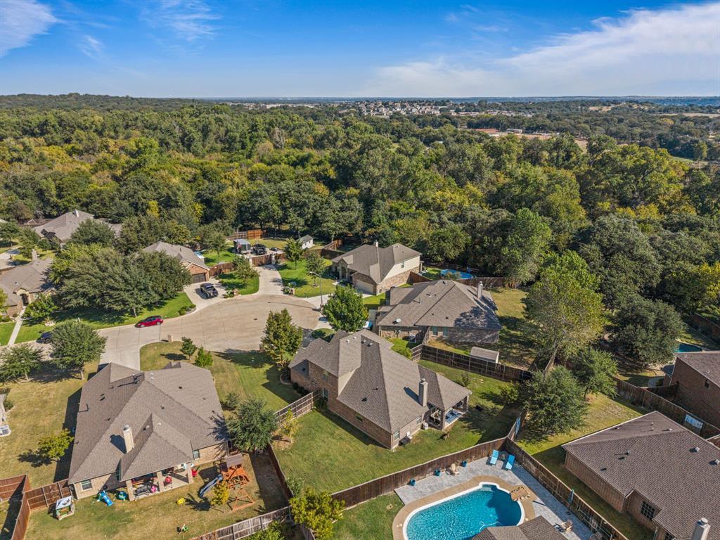108 Bosque Court Azle, TX 76020 - Photo 28 of 33 an aerial view of a house with a lake view