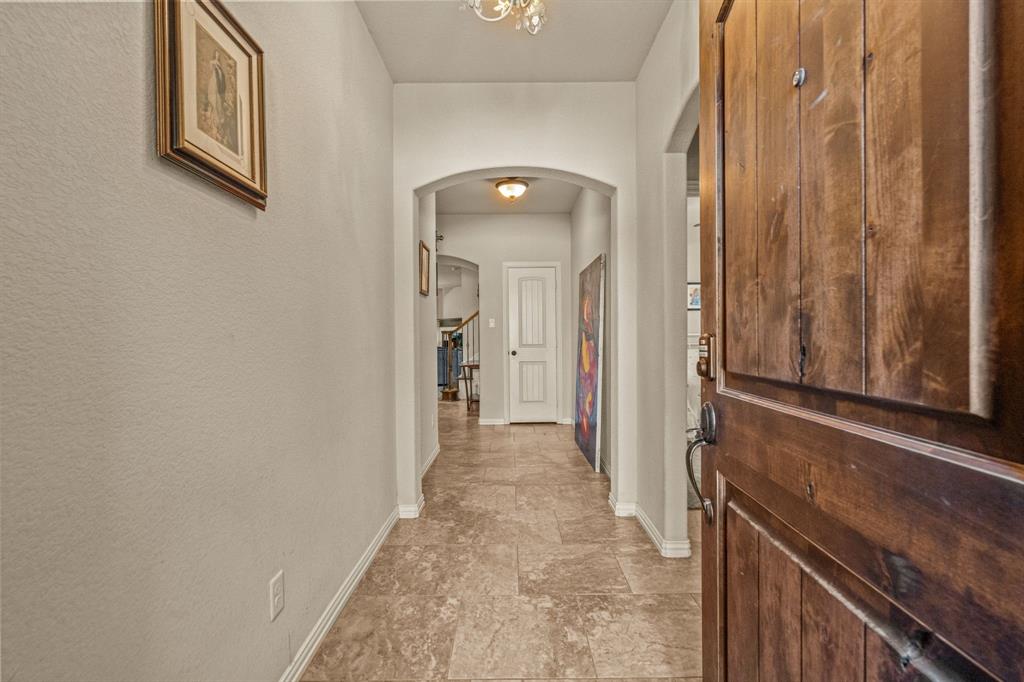 108 Bosque Court Azle, TX 76020 - Photo 6 of 33 a view of a hallway with wooden shelves