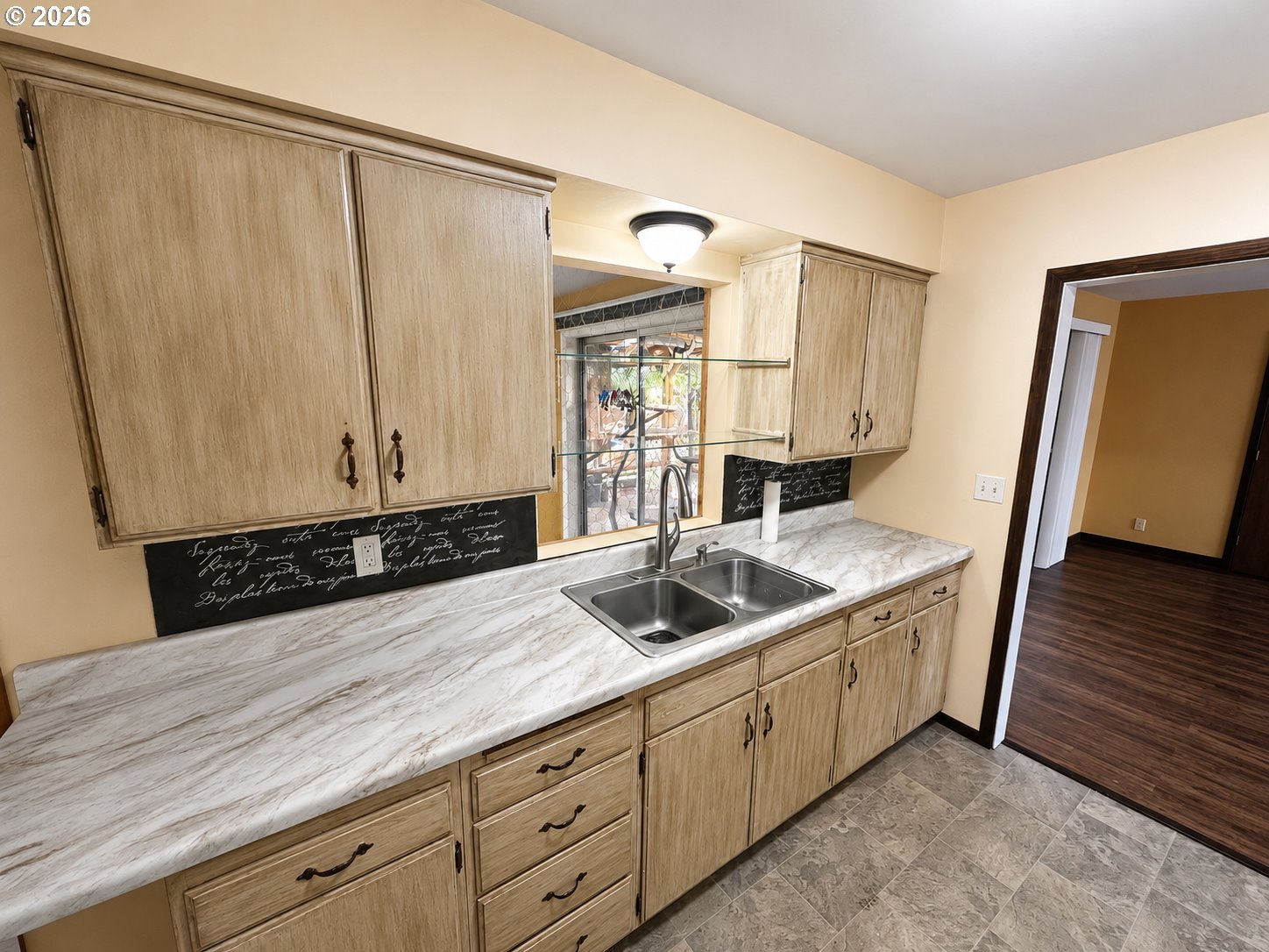 10 Southwest Peach Lane Winston, OR 97496 - Photo 22 of 22 a kitchen with a sink and a refrigerator