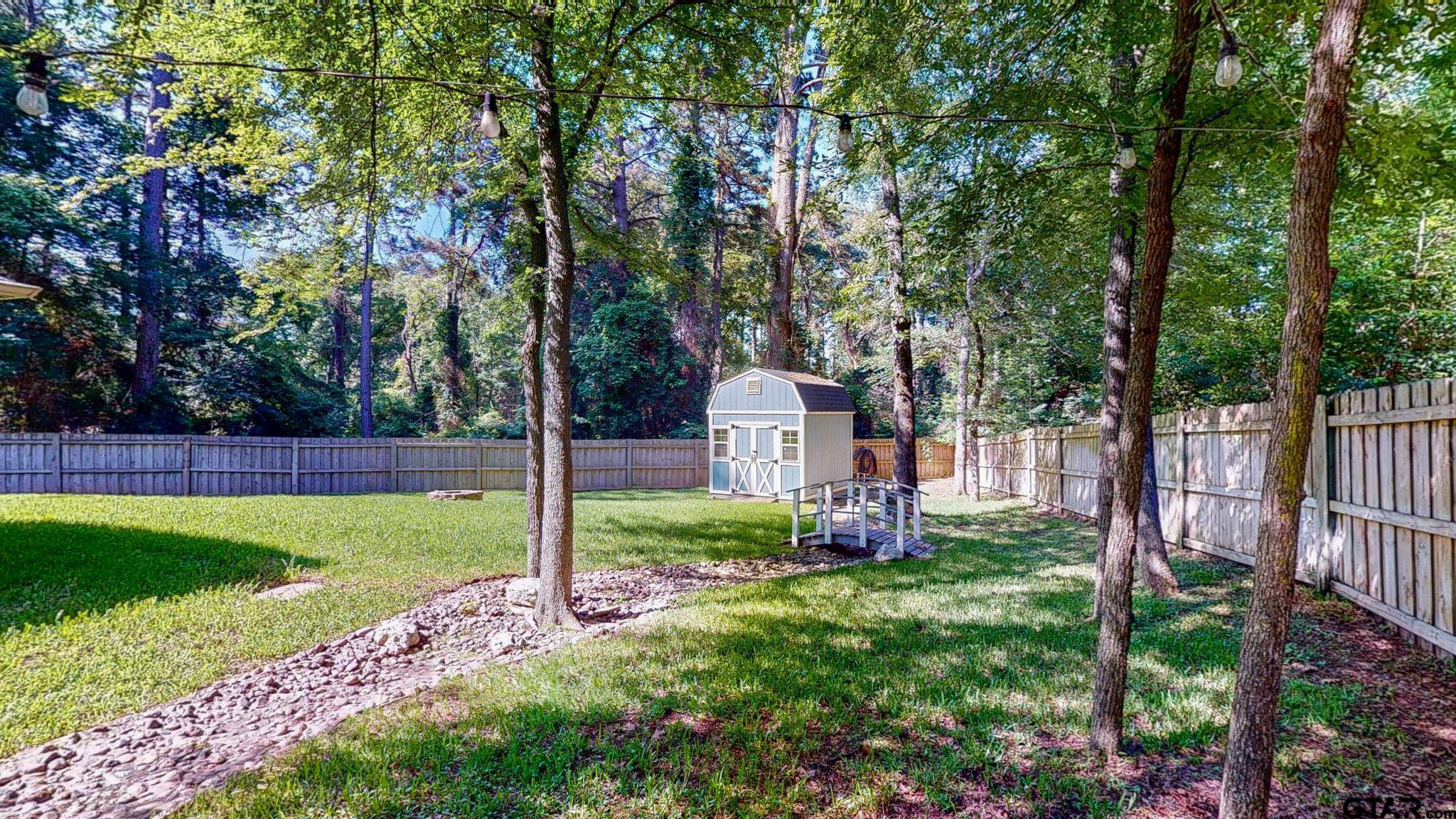 18488 Bluebird Circle Flint, TX 75762 - Photo 40 of 47 a view of a house with backyard and a tree