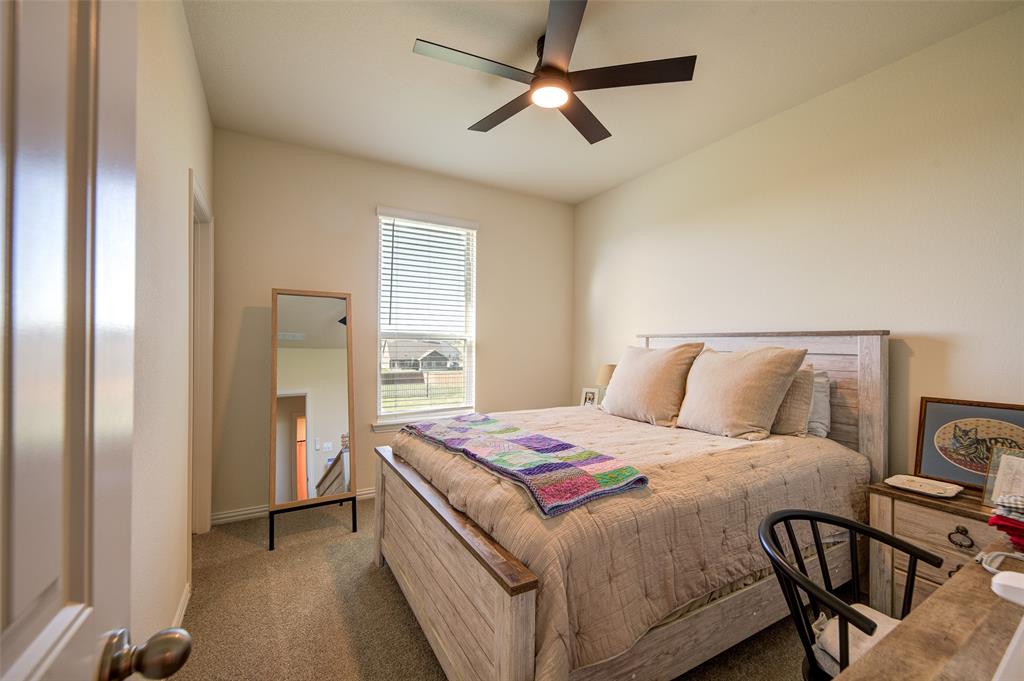 131 Clear Crk Lane Rhome, TX 76078 - Photo 17 of 29 Carpeted bedroom featuring ceiling fan and baseboards