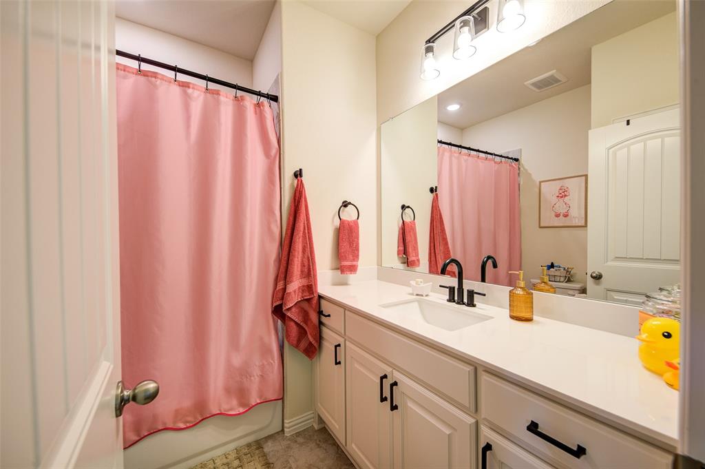 131 Clear Crk Lane Rhome, TX 76078 - Photo 18 of 29 Bathroom with vanity and shower / tub combo with curtain