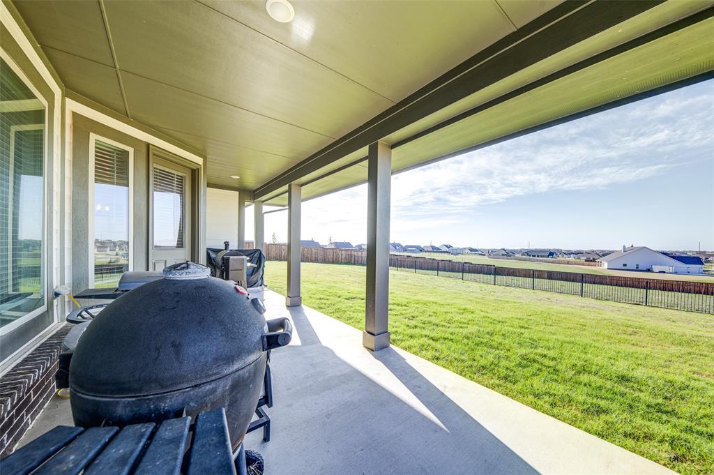 131 Clear Crk Lane Rhome, TX 76078 - Photo 23 of 29 Fenced backyard featuring a patio area and a residential view