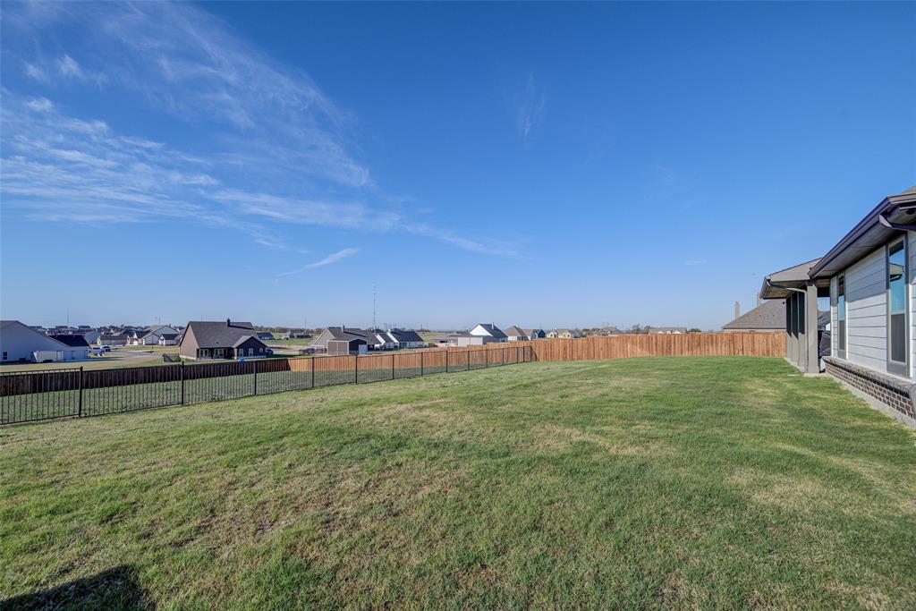 131 Clear Crk Lane Rhome, TX 76078 - Photo 27 of 29 Fenced backyard featuring a residential view