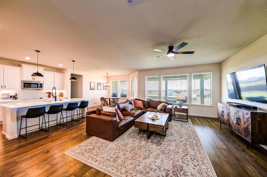 131 Clear Crk Lane Rhome, TX 76078 - Photo 4 of 29 Living room with dark wood-style flooring and ceiling fan