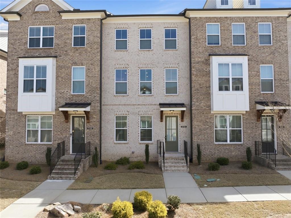 a front view of a house with a yard
