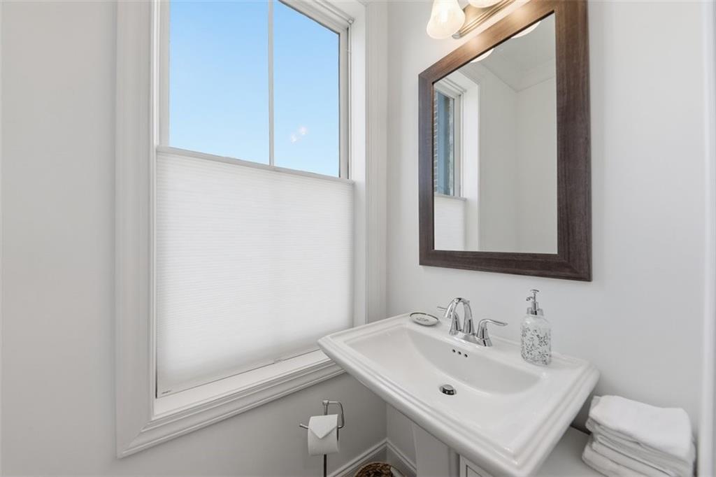 3193 Bartee Walk Suwanee, GA 30024 - Photo 12 of 27 a bathroom with a sink and a mirror