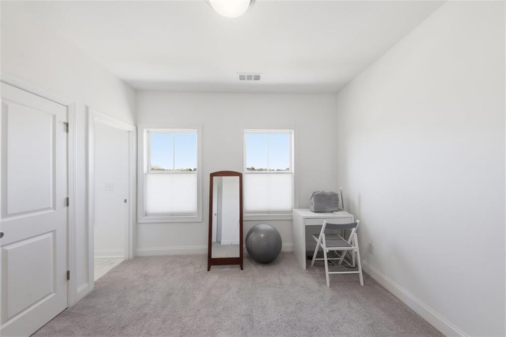 3193 Bartee Walk Suwanee, GA 30024 - Photo 18 of 27 a view of a room with table and chairs