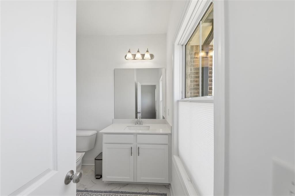 3193 Bartee Walk Suwanee, GA 30024 - Photo 19 of 27 a utility room with a sink dryer and washer