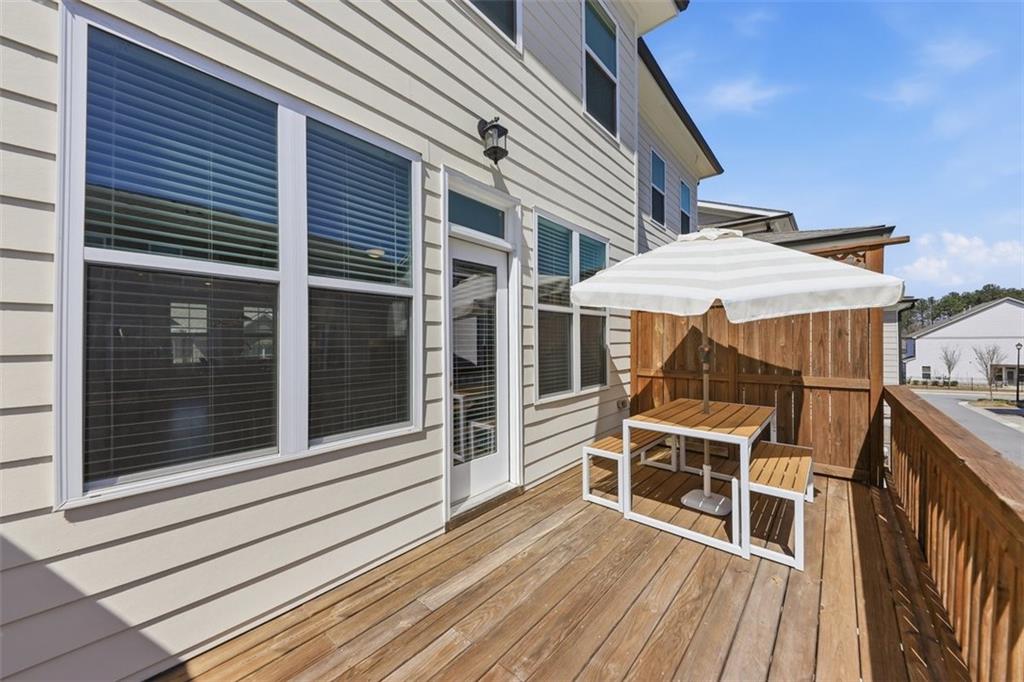 3193 Bartee Walk Suwanee, GA 30024 - Photo 21 of 27 a view of a house with a large window and wooden floor