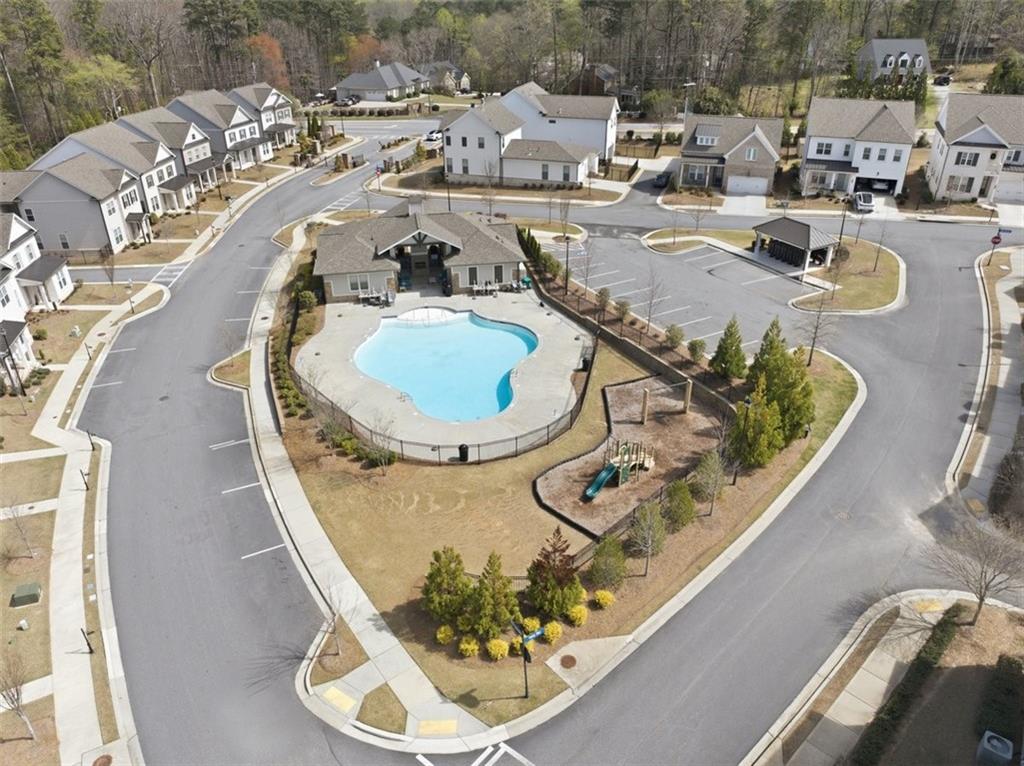 3193 Bartee Walk Suwanee, GA 30024 - Photo 25 of 27 an aerial view of a swimming pool with outdoor seating