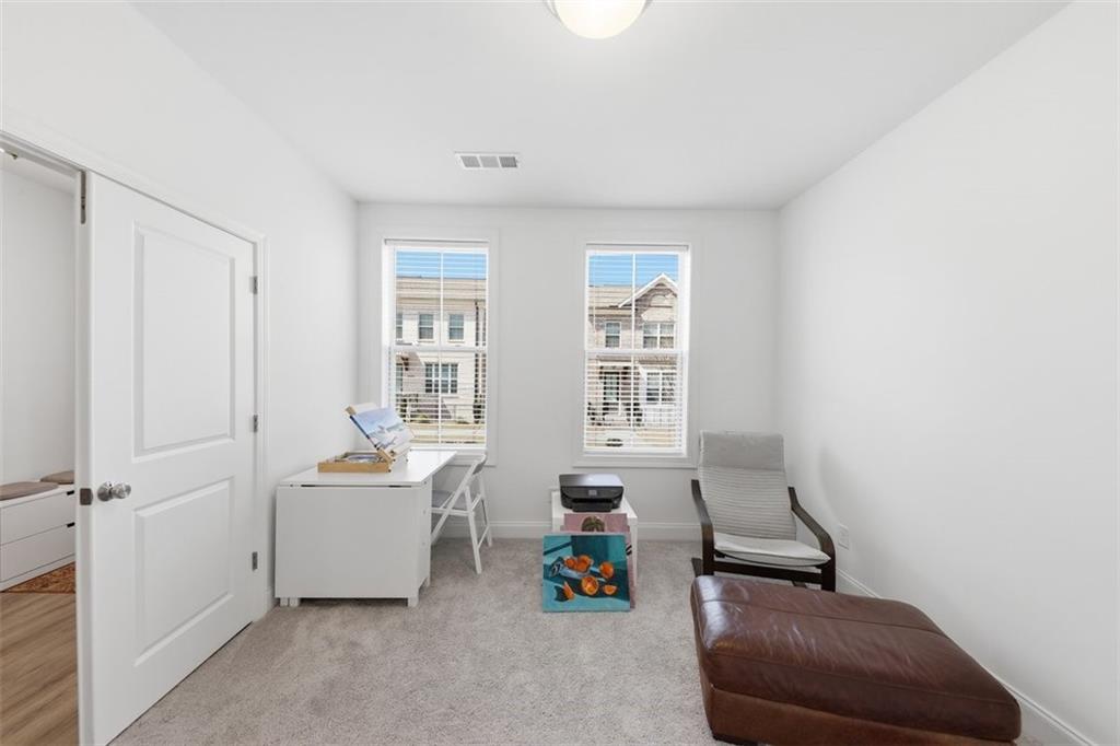 3193 Bartee Walk Suwanee, GA 30024 - Photo 3 of 27 a living room with furniture and a window