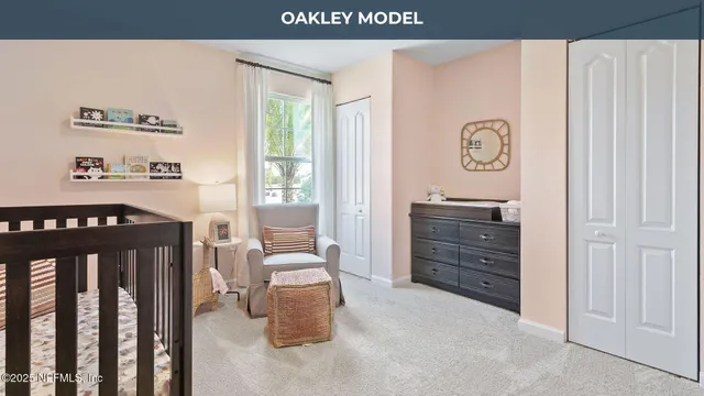a view of a bedroom with furniture and window
