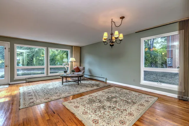 a living room filled with furniture and a table
