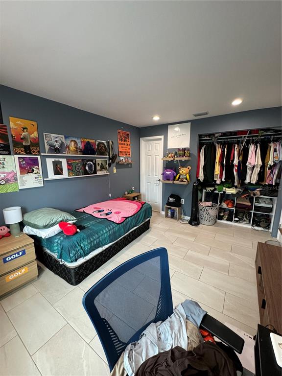 7102 Reindeer Road Tampa, FL 33619 - Photo 17 of 25 a living room with furniture and a flat screen tv