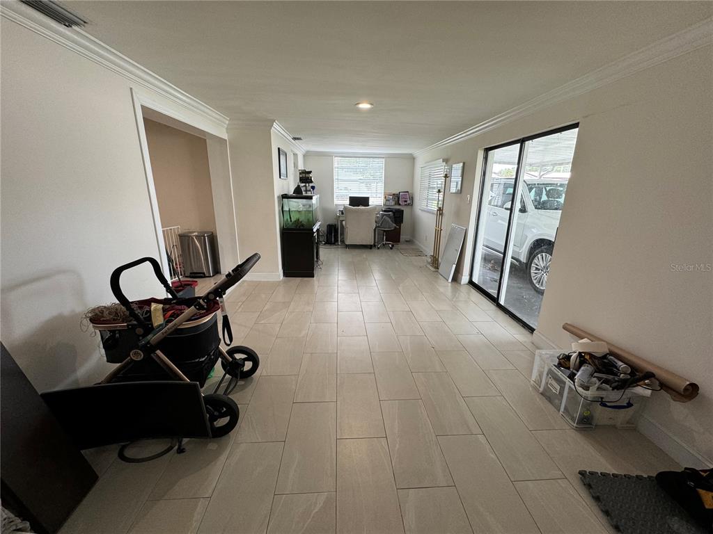 7102 Reindeer Road Tampa, FL 33619 - Photo 24 of 25 a view of a room with gym equipment