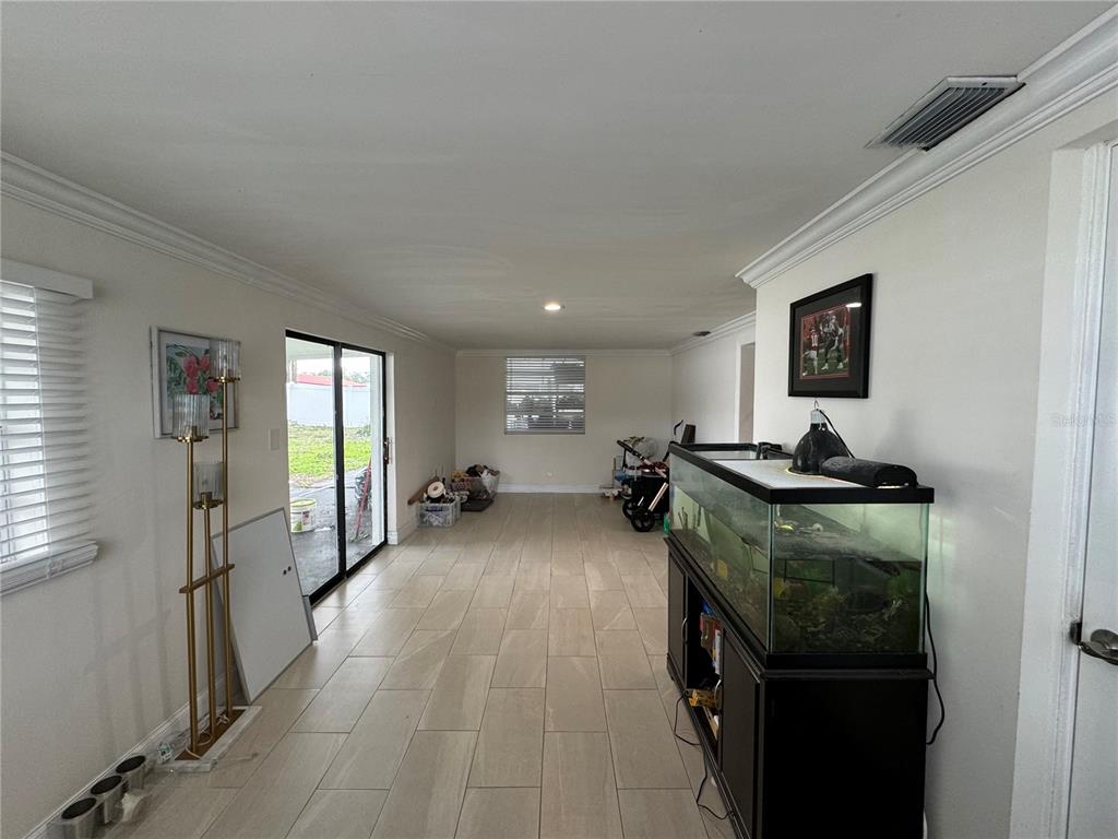 7102 Reindeer Road Tampa, FL 33619 - Photo 25 of 25 a view of a livingroom with furniture window and wooden floor