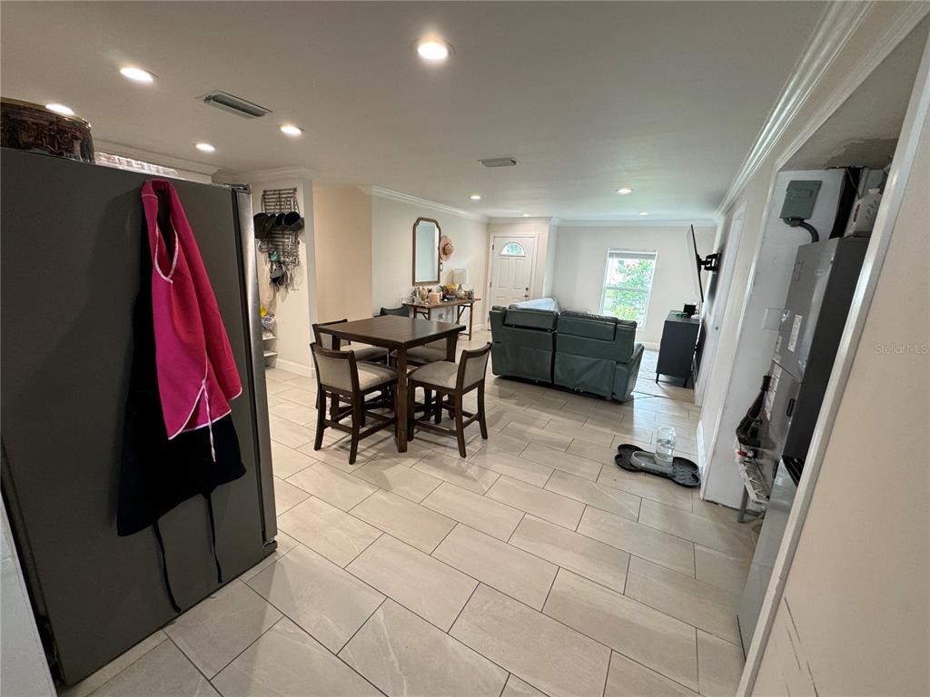 7102 Reindeer Road Tampa, FL 33619 - Photo 6 of 25 a living room with furniture and a large window